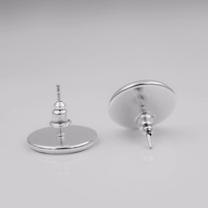 Detailed view of polished stainless steel earring studs and flat base DIY findings