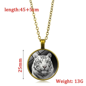 Vintage bronze necklace featuring a white tiger head glowing glass pendant with link chain