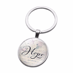 Detailed view of silver Bestfriends Hope keychain with vintage floral glass cabochon pendant