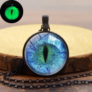 Blue dragon eye glowing pendant necklace with vintage black alloy chain in dark light