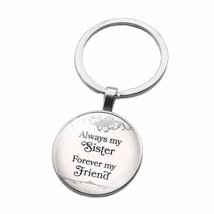 Detail of silver keyring featuring 'Always my Sister Forever my Friend' quote pendant