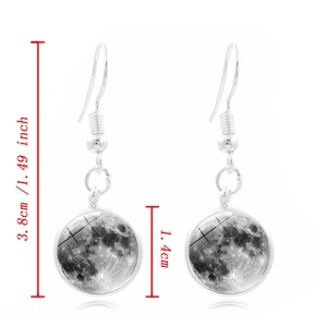 Detailed view of silver moon earrings with measurements 3.8cm length and 1.4cm diameter