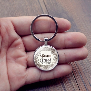 Handheld vintage Bestfriends keychain with Bosom Friend text and silver metal ring