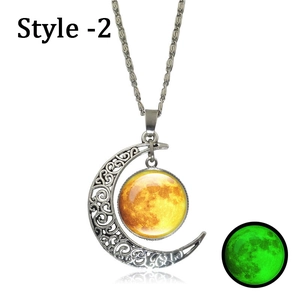 Glow in the dark moon pendant necklace with silver crescent filigree and green luminous effect