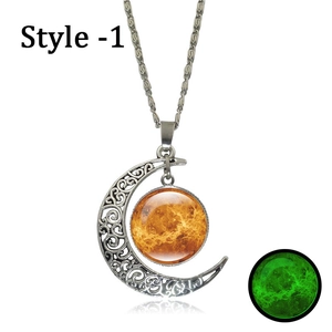 Detailed view of luminous crescent moon pendant with green glow-in-the-dark planet glass bead