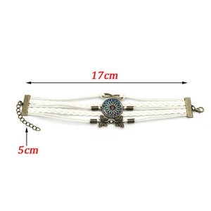 Détail du bracelet mandala tissé avec papillons en bronze et dimensions de longueur