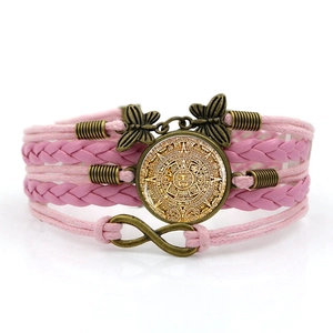 Pink multilayer braided bracelet featuring Aztec sun calendar pendant and butterfly charms