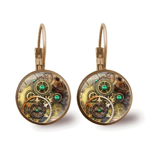 Vintage steampunk gear earrings with green gemstone and bronze metal hooks on white background