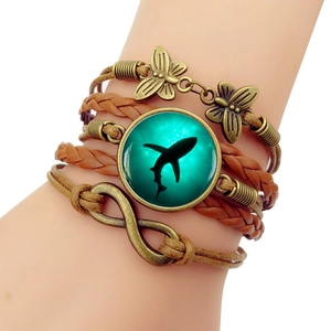 Multilayer leather shark bracelet with infinity and butterfly charms on wrist