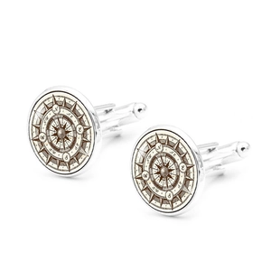 Detailed view of round vintage compass cufflinks with silver metal and engraved markers