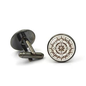 Vintage gunmetal compass cufflinks featuring a retro glass gemstone nautical design