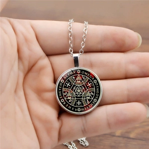 Detail view of Tree of Life necklace featuring mystical hexagram symbols under glass dome