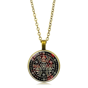 Macro detail of the tree of life glass pendant necklace with antique bronze metal finish