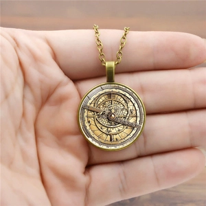 Vintage bronze compass pendant necklace with detailed star map and astronomical scales