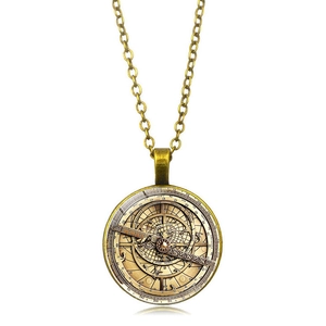 Detailed close-up of vintage bronze astrolabe pendant with intricate roman numeral scales