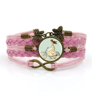 Bracelet rose multicouche avec papillons en bronze et cabochon en verre vélo vintage