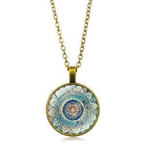 Detailed close-up of mandala yoga glass pendant necklace with antique bronze finish
