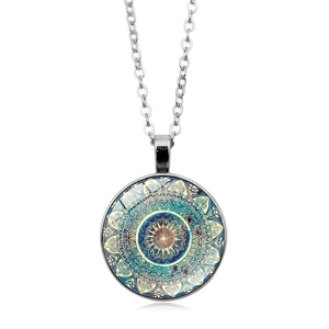 Detailed close-up of mandala geometric glass pendant necklace with silver chain link