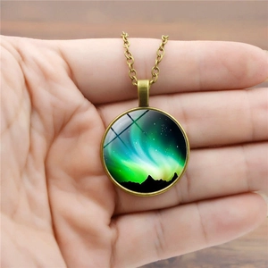 Vintage bronze aurora borealis glass stone pendant necklace with snowy mountain art