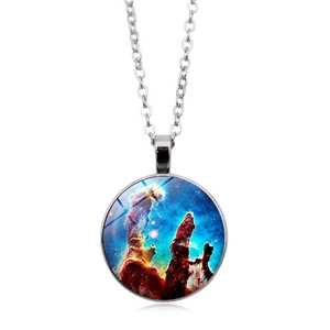Macro view of round glass pendant necklace featuring Pillars of Creation nebula pattern