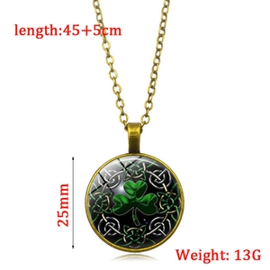 Vintage bronze necklace with green shamrock glass pendant and Celtic knot patterns