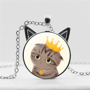 Close-up of cat-ear pendant with a cute grey tabby cat wearing a golden crown illustration