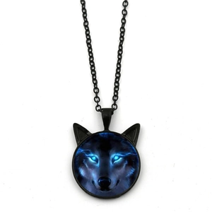 Close-up of wolf head pendant with glowing blue eyes on black link chain necklace