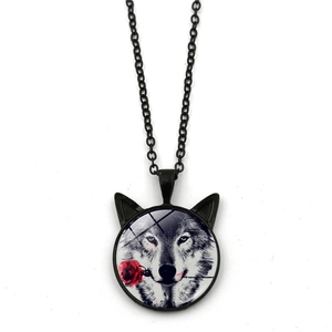 Detailed close-up of a black wolf head glass pendant with a red rose and cat ears frame