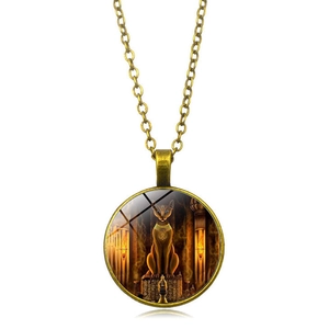 Detail of vintage bronze Egyptian Cat Goddess Bastet necklace with glass dome artwork