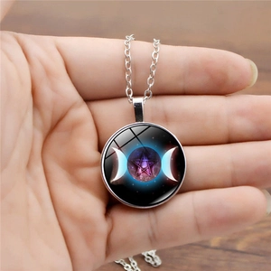 Triple Moon Goddess necklace with rotating purple pentagram pendant in silver-tone setting