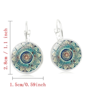 Silver lever-back earrings with vintage mandala pattern under a glass dome pendant