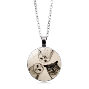 Detailed view of silver owl glass cabochon pendant necklace with three owls