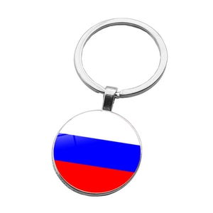 Detail of silver metal keychain with glass dome featuring the Russian flag design