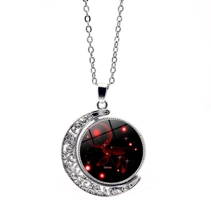 Detailed view of the luminous Cancer zodiac pendant with rotating double-sided moon charm