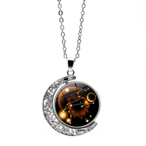 Detailed view of Leo zodiac necklace with luminous moon pendant on a silver chain