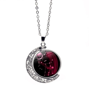 Close-up of Virgo constellation necklace with rotating moon pendant and silver link chain