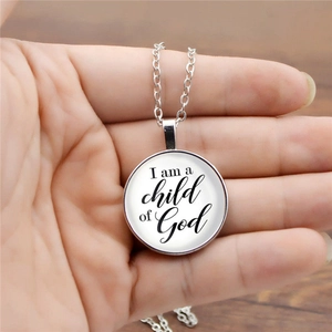 Silver-tone necklace with a glass dome pendant featuring I am a child of God text