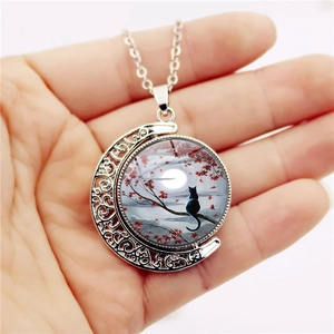 Vintage silver crescent moon necklace with black cat art glass pendant on a chain