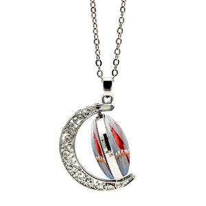 Rotating crescent moon necklace with double-sided cardinal bird pendant on white backdrop