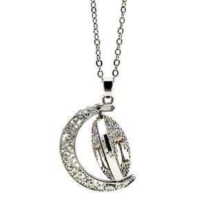 Detail of rotating double-sided Tree of Life pendant with crescent moon shape design