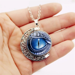 Vintage hollow crescent moon necklace with blue dragon eye pendant and silver-plated finish