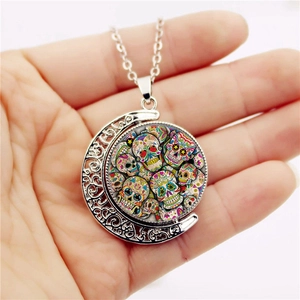Sugar skull spinning necklace with silver crescent moon pendant and colorful crystal charm