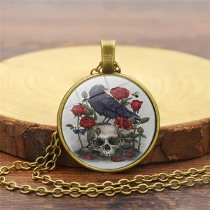 Detailed macro shot of vintage crow and skull glass pendant on a rustic wood base