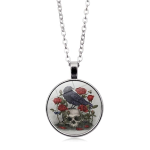 Gothic raven skull and red roses glass pendant necklace with silver chain on white background