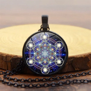 Macro view of Metatron's Cube sacred geometry pendant with starry galaxy glass dome