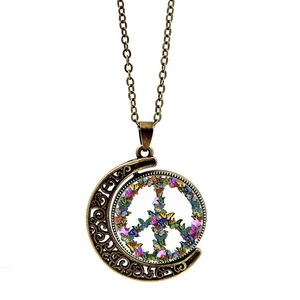 Vintage bronze peace sign necklace featuring a rotating moon pendant with colorful butterflies