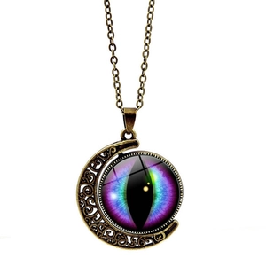 Vintage bronze crescent moon necklace featuring a mystical rotating dragon eye glass pendant