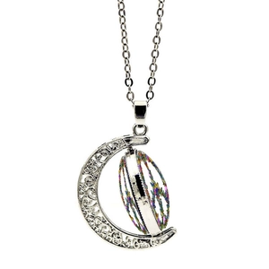 Detail of silver crescent moon necklace featuring hollow patterns and rotating pendant disc
