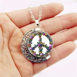 Rotating moon pendant necklace with silver finish and colorful butterfly peace symbol