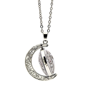 Macro detail of rotating silver moon pendant with realistic white tiger glass cabochon
